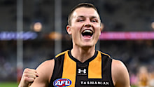 Jack Ginnivan of the Hawks celebrates the win.