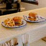 Tuckshop Coffee serves cheeseburgers and bacon and egg rolls.