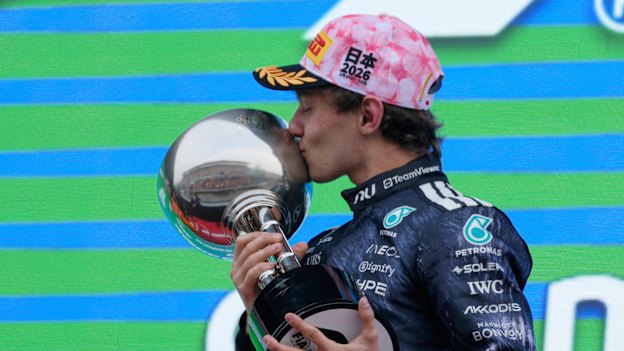 Mercedes driver Kimi Antonelli of Italy reacts on the podium after winning the GP.