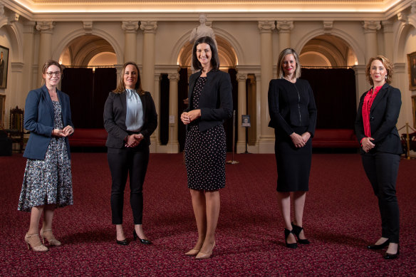 Ali Cupper, Bridget Vallence, Ellen Sandell, Steph Ryan and Gabrielle Williams in the Queen’s Hall at Parliament, surrounded by portraits of Victoria’s premiers, all but one of whom were male. 