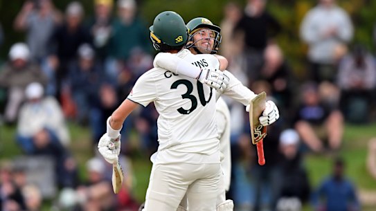Pat Cummins and Alex Carey celebrate victory in Christchurch.