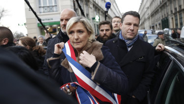 French far-right leader Marine Le Pen arrives at the march.
