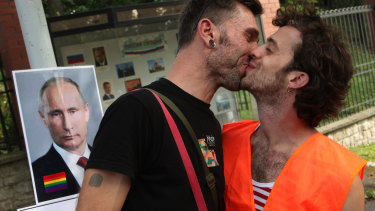A couple protests against anti-gay laws issued by Russian President Vladimir Putin in front of the Russian Embassy in Prague, Czech Republic, last year. 