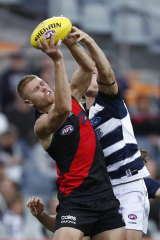 Peter Wright stretches for a mark for the Bombers in their Community Series match against Geelong.