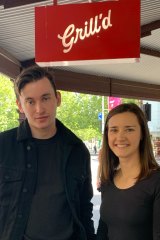 Grill’d worker Patrick Stevenson with Young Workers Centre director Felicity Sowerbutts at the Grill'd Carlton store on Saturday. 