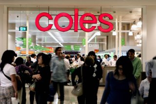 Coles has announced its staff will return to packing customer bags from Monday.