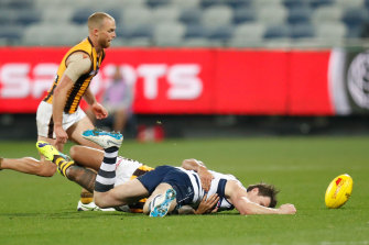 Patrick Dangerfield is tackled by Shaun Burgoyne during Friday night's match at GMHBA Stadium. 
