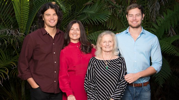 Marina Go in red, with her sons Lachlan (left) and Jackson (right) and mother Maria.