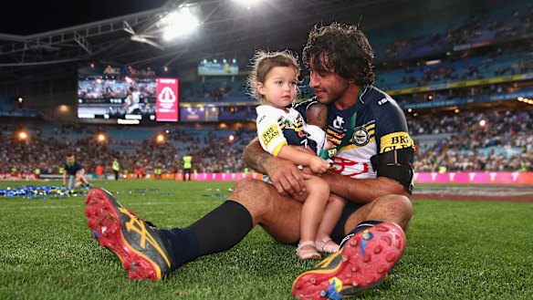North Queensland Cowboys captain Johnathan Thurston with daughter Frankie after winning the 2015 NRL grand final.