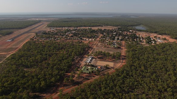 There have been riots in Aurukun, as a teenager and a man have been charged with murder.