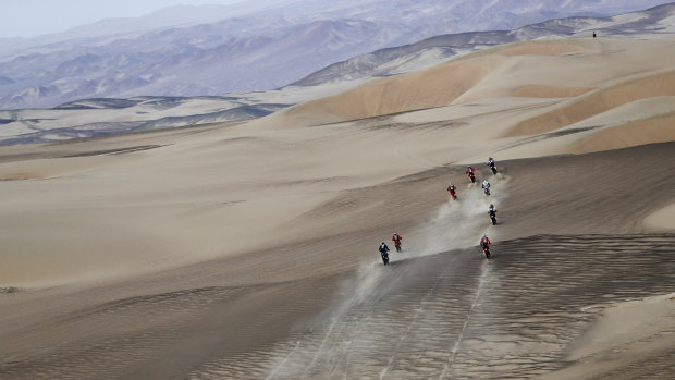 Competitors ride during stage nine of the Dakar Rally in Peru.