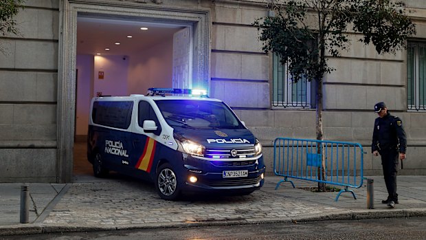 A Spanish National Police van, believed to be carrying Catalonian politicians and activists, arrives at the Spanish Supreme Court in Madrid on Wednesday.