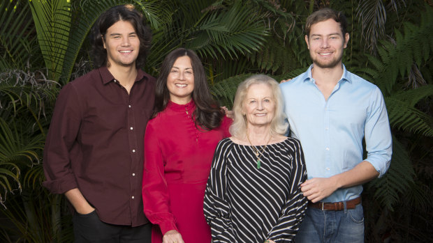 Marina Go in red, with her sons Lachlan (left) and Jackson (right) and mother Maria.