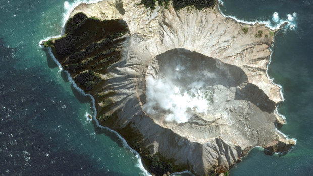 A satellite image provided by Maxar Technologies shows White Island in New Zealand before a volcano erupted.