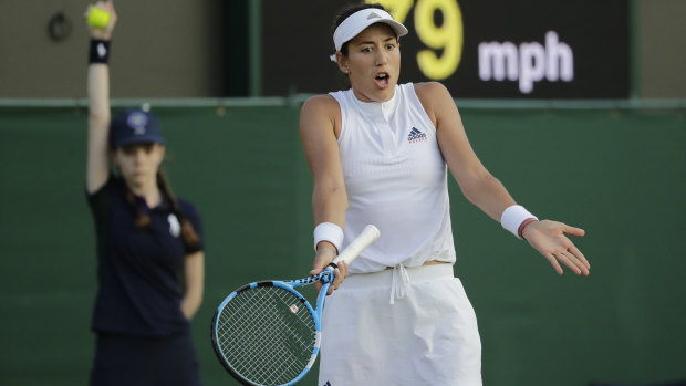 Spain's Garbine Muguruza gestures after losing a point to Alison Van Uytvanck of Belgium, during their women's singles match, on the fourth day at the Wimbledon Tennis Championships in London, Thursday July 5, 2018. (AP Photo/Ben Curtis)