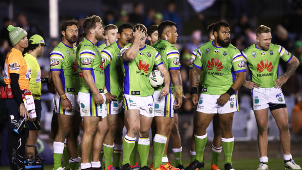 Done and dudded: Raiders players look dejected  as the decisions go against them   at Cronulla.  