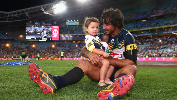 North Queensland Cowboys captain Johnathan Thurston with daughter Frankie after winning the 2015 NRL grand final.