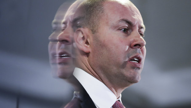 Treasurer Josh Frydenberg has sliced $2 billion off this year's forecast surplus.