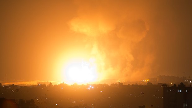 An explosion from Israeli airstrikes hits Gaza City early on Thursday. 