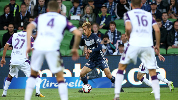 Driving run: Victory's marquee man Keisuke Honda looks for a way through the Perth Glory defence.