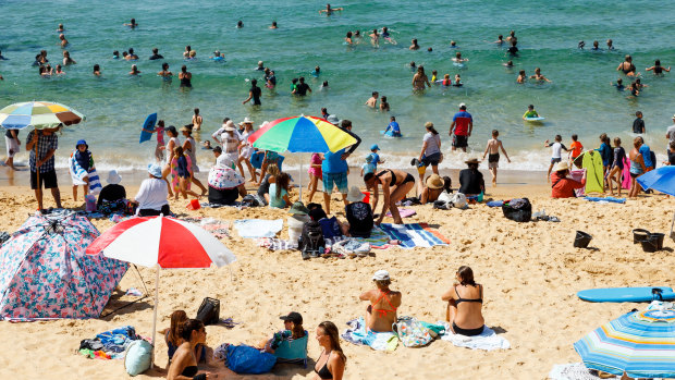 Beachgoers flock to Newcastle's Bar Beach on Friday morning. 