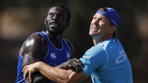 Majak Daw battles it out at training last month.