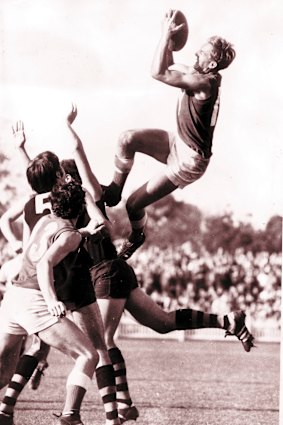 SA footy great Barrie Robran soars for a mark in the SANFL.