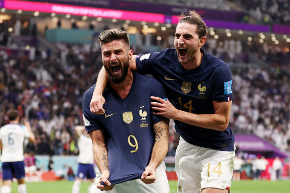 Olivier Giroud (left) celebrates the winning goal.