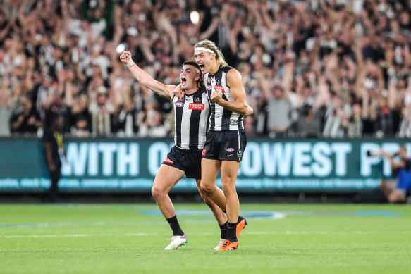 Collingwood defenders Brayden Maynard and Darcy Moore celebrate.