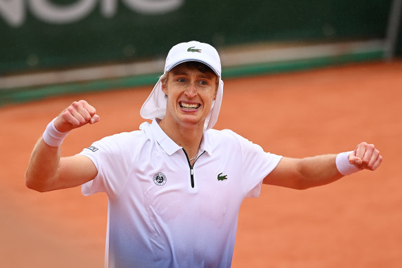 Marc Polmans celebrates a career high point on the Roland Garros clay.