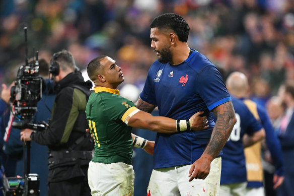 Cheslin Kolbe of South Africa consoles Romain Taofifenua of France after their quarter-final.