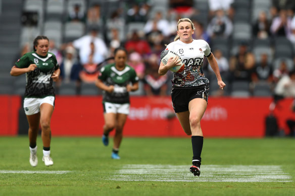 Jaime Chapman races away to score her intercept try.