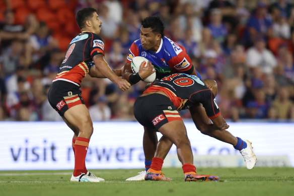The Knights’ Jacob Saifiti charges into the Dolphins defence on Thursday night.