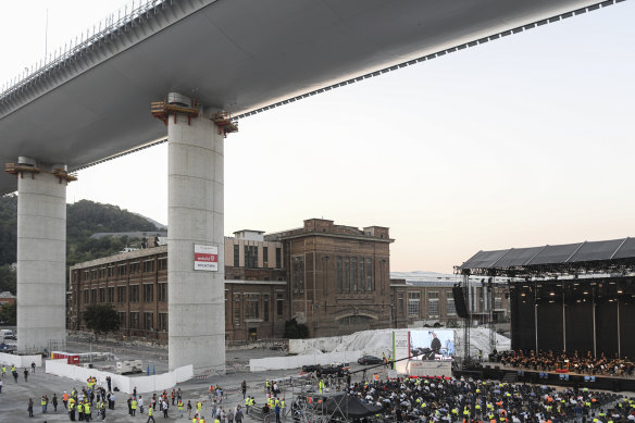Construction workers are treated to a concert at the foot of their newly-built Genoa bridge in Italy.