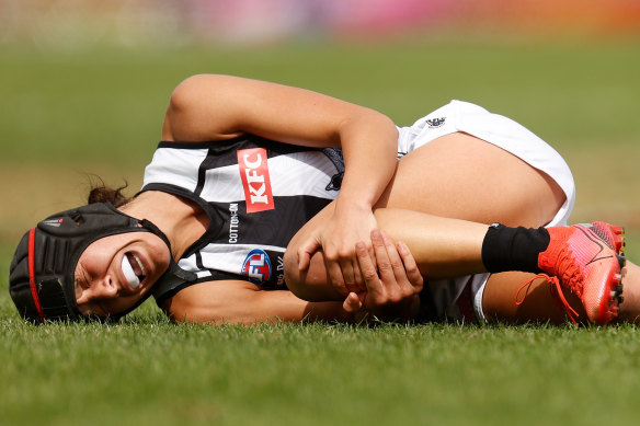 In agony: Collingwood’s Brittany Bonnici clutches at her knee during round eight. 