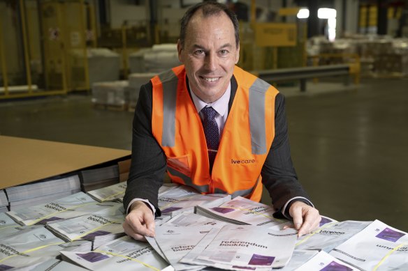 Then-deputy electoral commissioner Jeff Pope with the yes/no pamphlet for The Voice to parliament referendum in 2023.