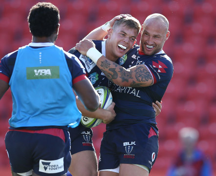 Tom Pincus (left) of the Rebels celebrates with Bill Meakes after scoring a try on Saturday. 