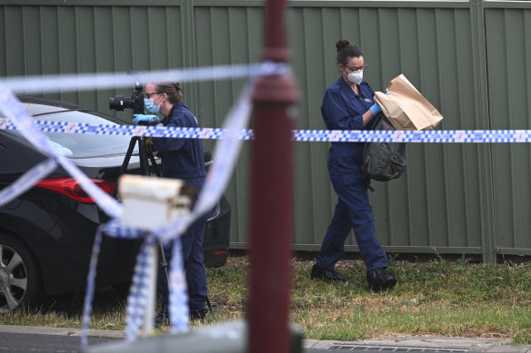 Police at the scene of a Wyndham Vale home where two men were killed on Saturday morning.