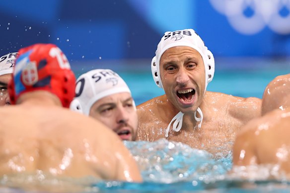 Serbian players huddle during their clash with Australia.