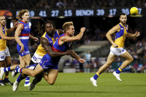 Mitch Wallis is tackled by Nic Naitanui.