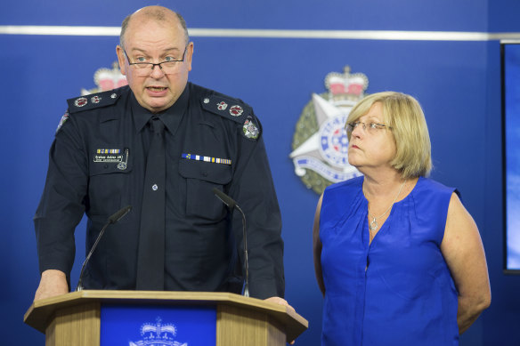 Chief Commissioner Graham Ashton with Police Minister Lisa Neville at a media conference in February.