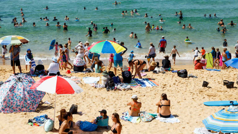 Beachgoers flock to Newcastle's Bar Beach on Friday morning. 