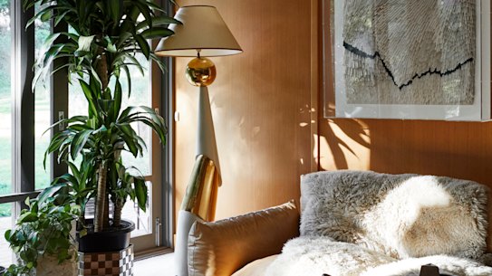 “The living spaces all face north, and I love how the light dances on the floor throughout the day,” says Haag. In the family 
lounge, a 1970s lamp by François Chatain was bought through 1st Dibs and the sofa, from Space, is by Arflex.