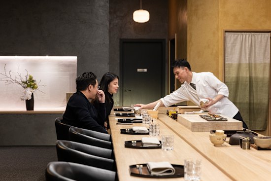 Chef Tomotaka Ishizuka behind the counter at Tomo-An kaiseki restaurant.