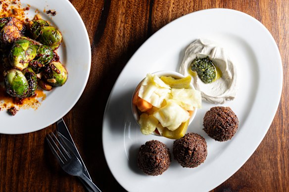 Falafel with tahini, pickles and zhoug.