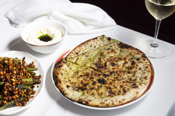 Wood-fired okra (left) and matar kulcha (pea-stuffed bread with stracciatella and burnt green onion oil).