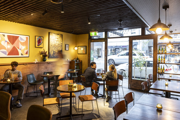 The Walrus’ welcoming timber and yellow interior.