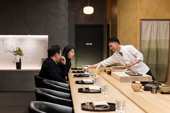 Chef Tomotaka Ishizuka behind the counter at Tomo-An kaiseki restaurant.
