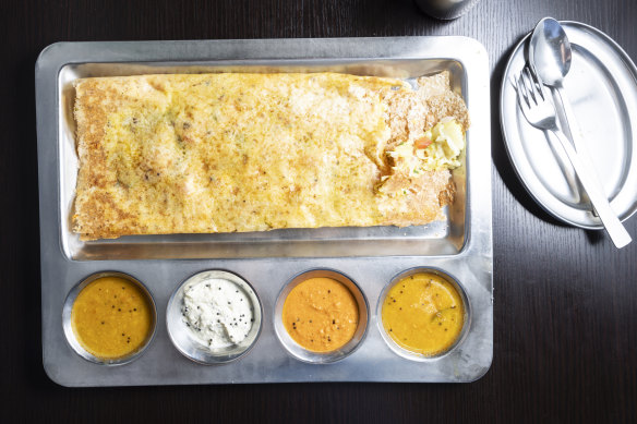 The floppier rava dosa, made with semolina, here filled with vegetables and paneer.