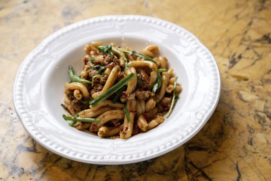 East meets West in a bowl of casarecce with Lao sausage, snake beans and garlic chives.